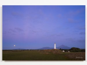 Mt Taranaki and Cape Rd Lighthouse Pungarehu during full moon